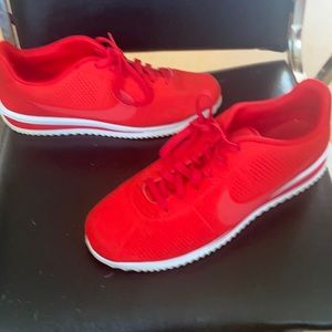 Men’s red Nike sneakers